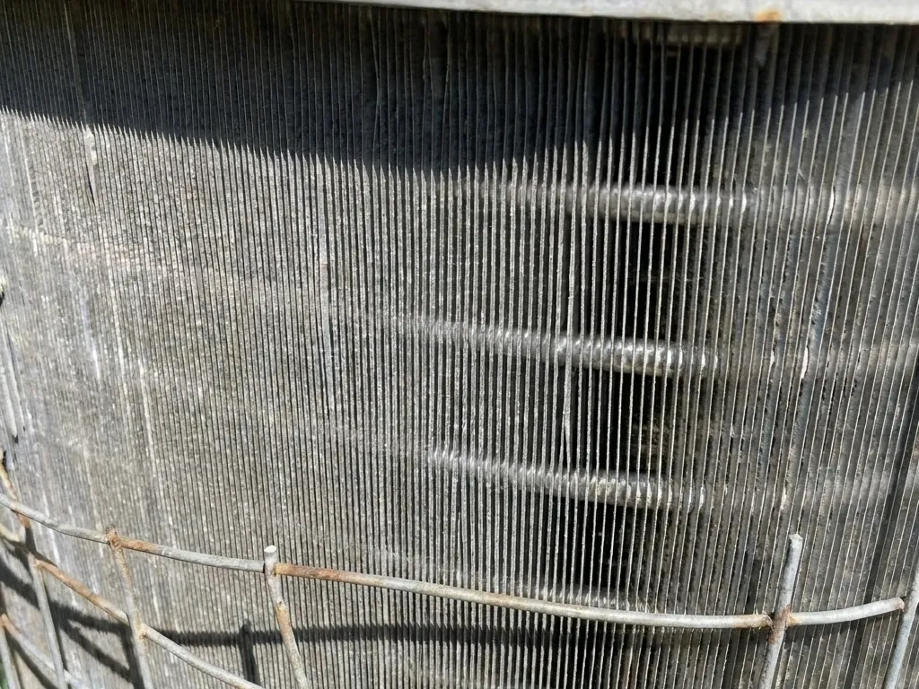 The same condenser coil, washed clean